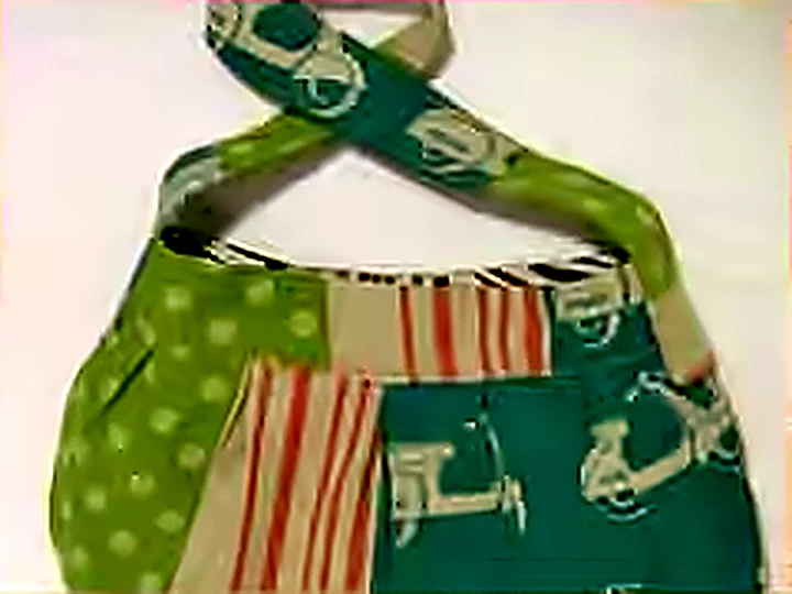 A patchwork shoulder bag sewn from the Etsuko Furuya scooter print.